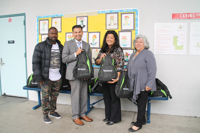 HGNNC delivers backpacks to schools